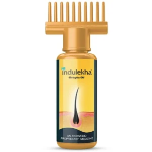 Bottle of Indulekha Bringha Oil with comb applicator.